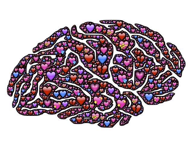 An illustration of hundreds of small heart forming the shape of a brain.