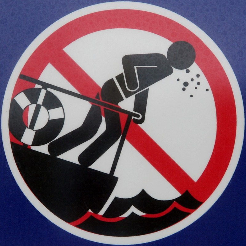 Warning sign at a carnival that those who easily experience motion sickness should not go on this ride.