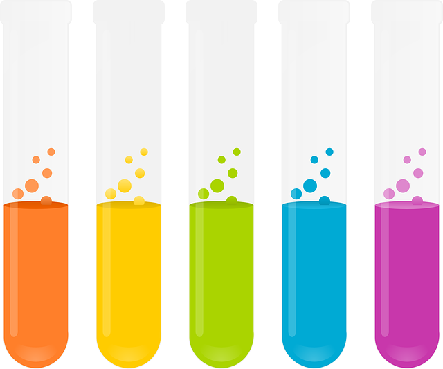 An image of five test tubes with substances of varying colors bubbling inside them