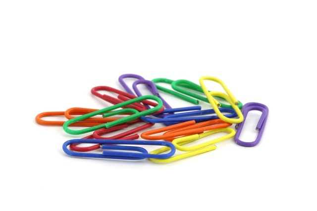 An image of colorful paperclips