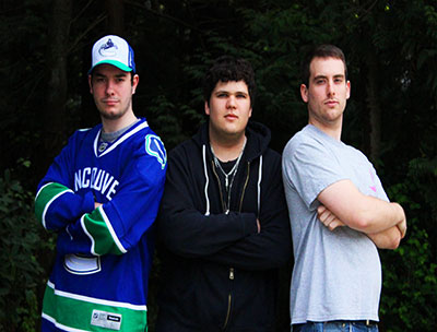 Chris Cameron, Edward Puckering and Kevin Smith smiling and facing the camera.