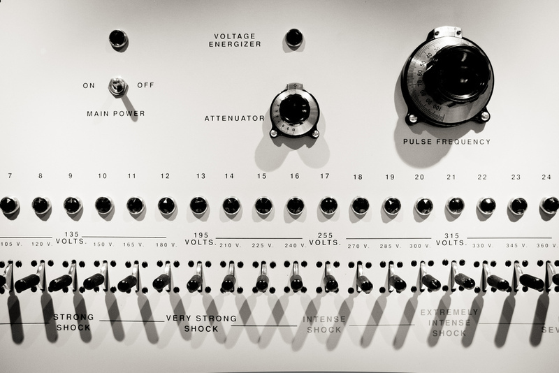 Close up of the controls of the shock machine used in the Milgram Experiment. The machine shows settings for "strong shock", "very strong shock", "intense shock", "extremely intense shock", and "severe shock".