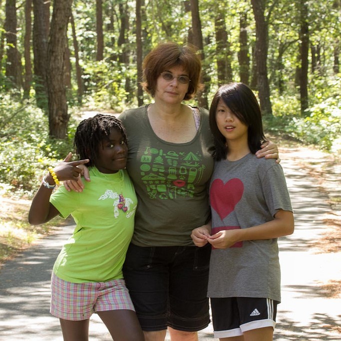 A mother and two adopted daughters.