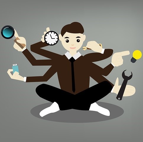 Illustration of a man with six arms doing six tasks simultaneously.