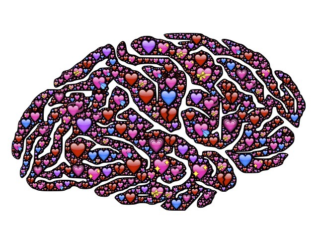 Una ilustración de cientos de pequeños corazones formando la forma de un cerebro.