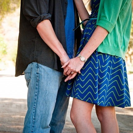 A man and woman holding hands.