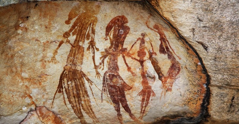 A cave painting of human figures.