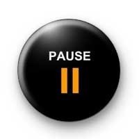 A black button that says "Pause" on it in yellow letters