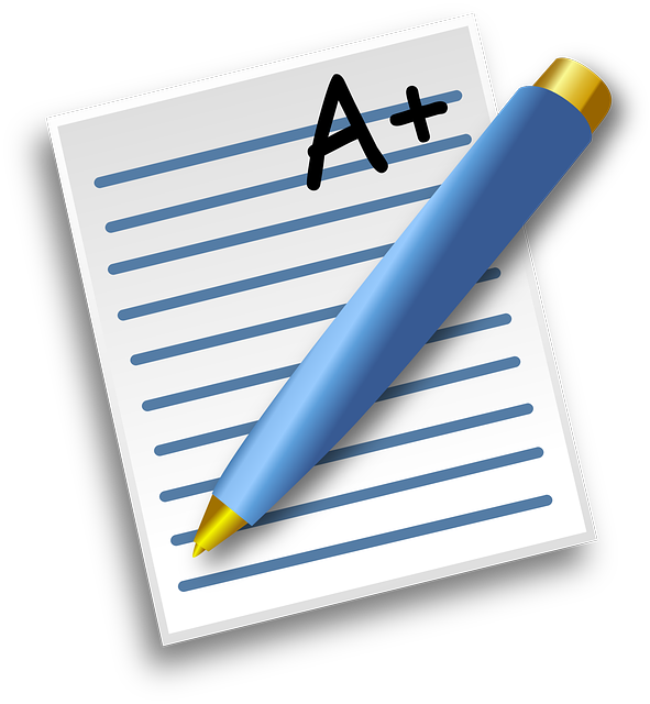 A pen and a graded paper listing the grade as A plus